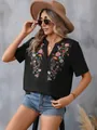 Summer black short sleeve top with intricate floral embroidery and lace neckline trim. - Black