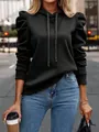 Detail view of stylish black hooded sweatshirt featuring elegant puff sleeve design - Black