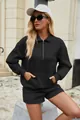 Detailweergave van het zwarte tweedelige setje met half-zip sweatshirt en short - S / Boven- En Onderstuk / Zwart