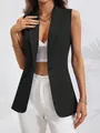 Detailed shot of a black sleeveless single-button blazer for women in modern style - S / Tops / Black