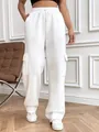 Close-up detail of stylish white cargo wide-leg sweatpants featuring side flap pockets - White