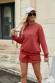 Outdoor detail view of a casual red two-piece sweatshirt and shorts set on a model - S / Top And Bottom / Burgundy