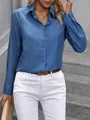 Detailed macro view of a blue long-sleeved button-up shirt with linen-like texture - S / Denim Blue