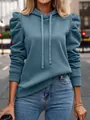 Detail view of stylish blue long sleeve hooded sweatshirt with unique puff sleeves - Teal