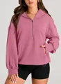 Detail view of pink women's half-zip hoodie with kangaroo pocket and hooded design - M / Tops / Purple