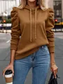 Close-up detail of women's camel hoodie featuring puff sleeves and drawstring hood - S / Tops / Dark Brown