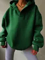 Detailansicht eines dunkelgrünen Oversized-Hoodies mit Kapuze - S / Oberteile / Grün