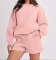 Close-up of pink two-piece loungewear set with sweatshirt and drawstring shorts. - S / Top And Bottom / Pink