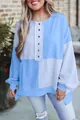 Oversized color block sweatshirt with button detail worn by a smiling model outdoors - S / Tops / Sky Blue