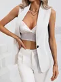 Close-up of a chic white sleeveless blazer vest with single black button detail. - S / Tops / White