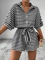 Elegant black and white striped button-down romper with waist tie and collar details - S / Top And Bottom / Black