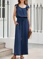 Detail view of navy blue ruffled sleeveless jumpsuit with textured fabric and wide legs - S / Top And Bottom / Navy Blue