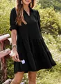 Close-up detail of the elegant V-neckline and pleated texture on this black summer dress. - Black