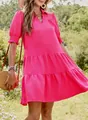 Model wearing a bright pink V-neck ruffled mini dress in a sunlit garden setting. - S / Dresses / Rose Red