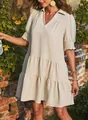 Elegant beige pleated V-neck dress featuring smocked puff sleeves shown on a model. - M / Dresses / Off White