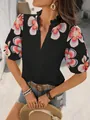 Détail du haut noir à col en V pour femme avec manches bouffantes à fleurs - S / Hauts / Noir