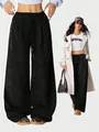 Detailed view of high waisted black corduroy wide-leg trousers for a casual outfit. - S / Bottoms / Black