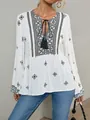 Detailed shot of retro ethnic blouse with tassels and intricate embroidery patterns - S / Tops / White