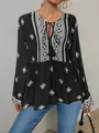 Close-up of retro ethnic style blouse with V-neck tie-front and geometric patterns - S / Tops / Black