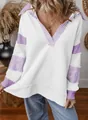 Detailed view of a white oversized V-neck sweatshirt with purple striped accents - White and Purple