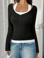 Detail view of the black and white halter fake two-piece top with buttons - S / Tops / Black