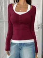 Close-up of burgundy fake two-piece long sleeve top with halter neck and button detail - S / Tops / Dark Red