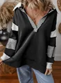 Detail of loose black sweatshirt with white striped deep V-neck and sleeve panels - Black