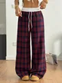 Close-up of red and black plaid high-waisted trousers with white drawstring waist - S / Bottoms / Red