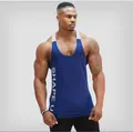 Detailed view of men's gym tank top with 'SHAPE U' vertical side print in navy - M / Tops / Blue