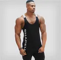 Detail view of professional men's athletic tank top with contrast straps and SHAPEU print - M / Tops / Black
