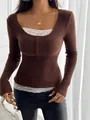 Close-up detail of a brown ribbed long sleeve top featuring lace trim and buttons - S / Tops / Coffee