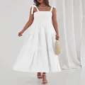 Macro view of elegant white smocked bodice and tiered skirt on summer maxi dress. - S / Tops / White