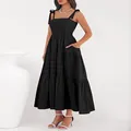 Full view of a black smocked tiered maxi dress featuring elegant ribbon shoulder straps. - S / Tops / Black