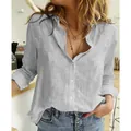 Detail view of a loose-fit grey linen button-down shirt for women in a casual setting - S / Tops / Gray