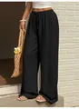 Dettaglio di pantaloni casual neri a gamba larga con coulisse e tessuto strutturato - Taglia S / Pantaloni e gonne / Nero