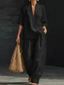 Vista dettagliata del completo nero a due pezzi con top con scollo a V e pantaloni larghi - Taglia S / Top E Pantaloni / Nero