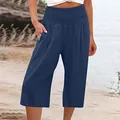 Dettaglio ravvicinato di pantaloni blu scuro a gamba larga con vita alta elasticizzata - Blu navy