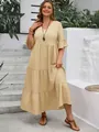 Full-length outdoor view of a tiered beige V-neck maxi dress featuring ruffled sleeves - 1XL / Apricot