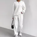 Set due pezzi bianco in maglia a trecce con top a girocollo e pantaloni jogger da donna - Taglia S / Top E Pantaloni / Bianco