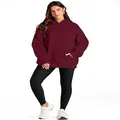 A fashion woman wearing a burgundy oversized hooded sweatshirt with black leggings - S / Tops / Burgundy