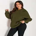 Detailed view of women's olive green oversized hoodie with a cozy kangaroo pocket. - Army Green