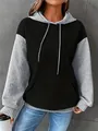 Detail view of a women's color-blocked waffle knit pullover hoodie with grey sleeves. - S / Tops / Black and Gray