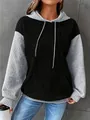 Close-up detail of women's stylish color-block waffle texture drawstring hoodie outfit - S / Tops / Black and Gray