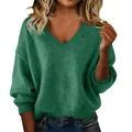 Detail view of women's loose green V-neck knitted sweater with soft texture for winter - S / Tops / Green