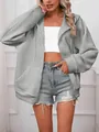 Vista dettagliata di una giacca grigia con cappuccio in maglia a nido d'ape da donna. - Taglia S / Top / Grigio