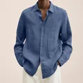 Detail view of blue long-sleeved linen shirt for men with button-down closure. - S / Blue