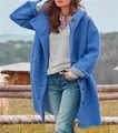 Women's vibrant blue long hooded wool coat with stylish button details in outdoor setting. - S / Tops / Blue