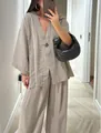 Detailed view of women's loose V-neck linen-style top and wide-leg pants set - S / Top And Bottom / Light Gray