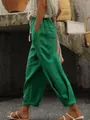 Side view of green cotton linen casual pants with elastic drawstring waist and pockets - Green