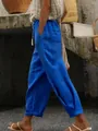 Detail view of casual blue linen pants featuring elastic drawstring waist and side pockets - S / Bottoms / Blue